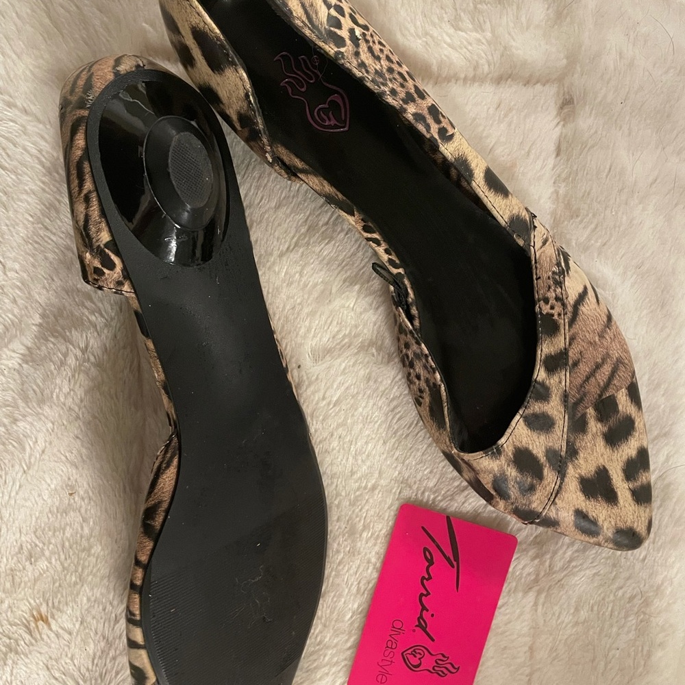 leopard print flat with tiny kitten heel.
